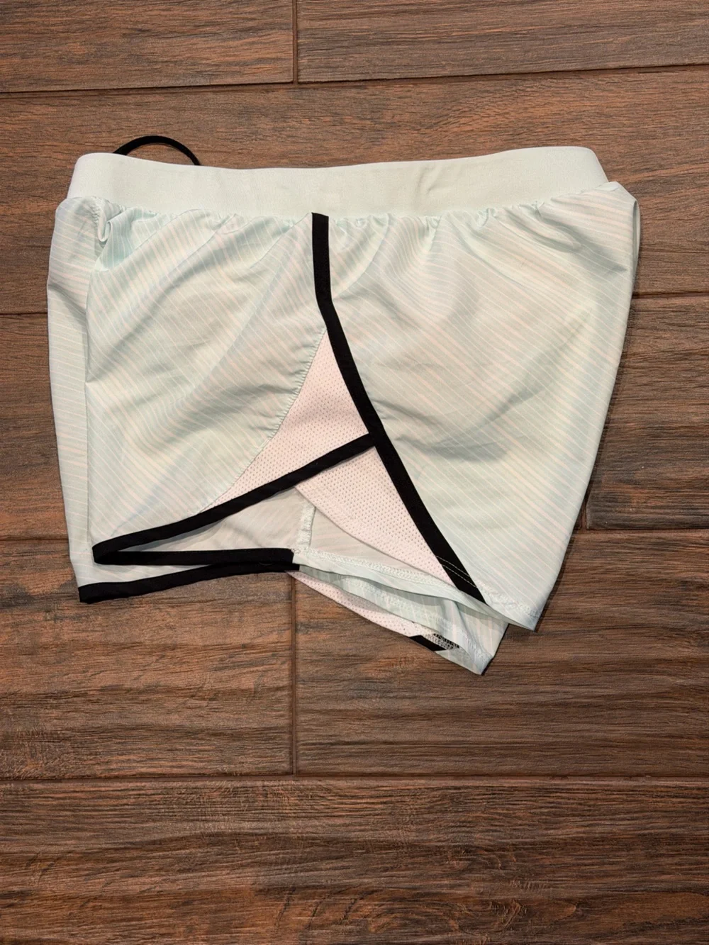 Under Armour Women's light blue Athletic Shorts with Black Trim, size S running